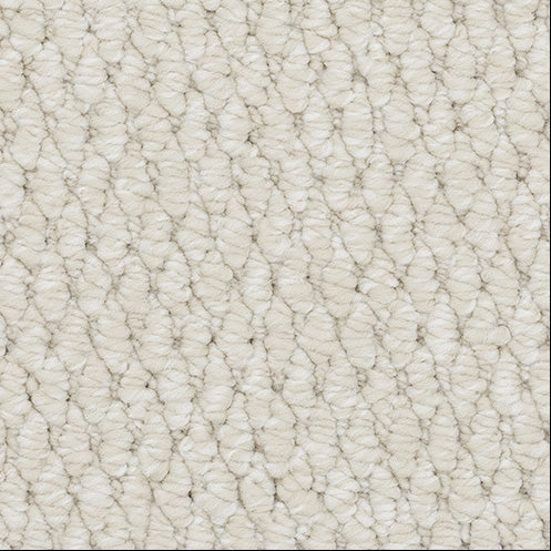 Close-up of textured beige carpet.