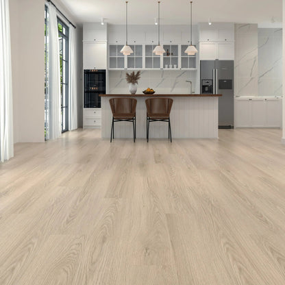 Light oak wood flooring shown in a modern kitchen interior with white cabinetry, pendant lights, two brown bar stools, and a stainless steel refrigerator.