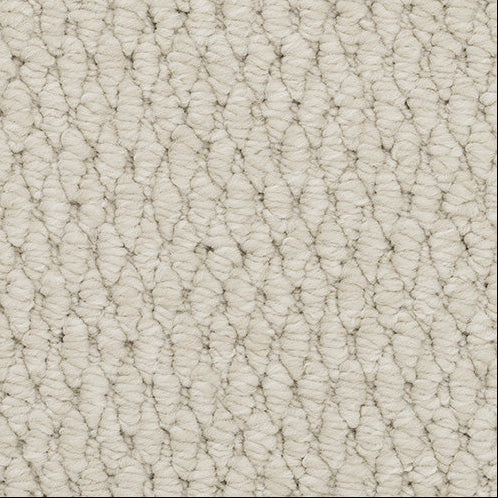 Close-up of beige carpet texture.