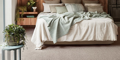 comfortable and cozy bedroom with light brown soft carpet