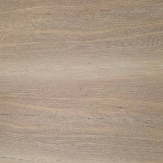 A close-up view of a light beige hybrid  wood grain surface with subtle natural texture and horizontal grain patterns.