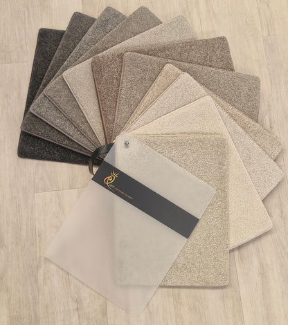 Collection of carpet samples in various shades.