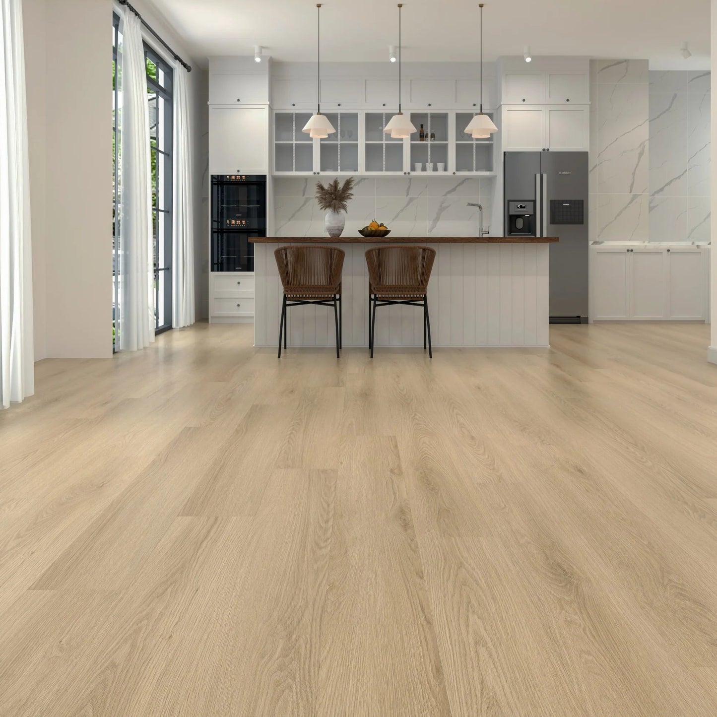 Light oak wood flooring shown in a modern, bright kitchen interior with white cabinetry, a central island, and two brown chairs.