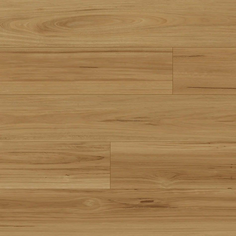 Light brown laminate flooring planks with visible natural grain and subtle variations in tone.