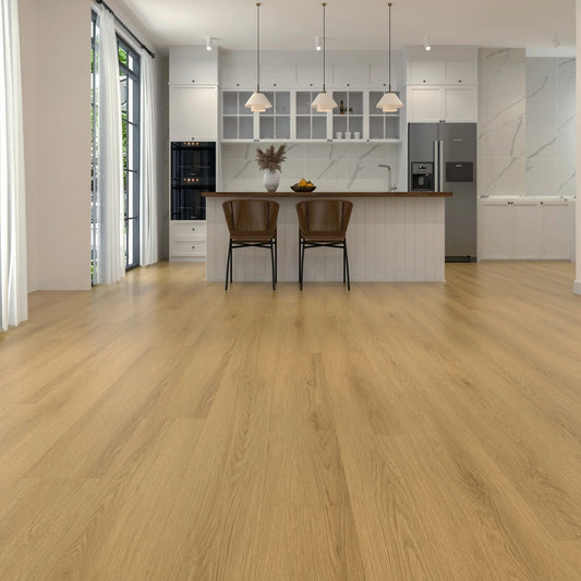 Light oak wood-look laminate flooring shown in a modern kitchen interior with white cabinetry, pendant lights, two brown bar stools, and stainless steel appliances.
