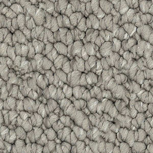 Detailed close-up of solution dyed nylon carpet featuring a chunky loop pile texture, ideal for living rooms and bedrooms. light brown colour