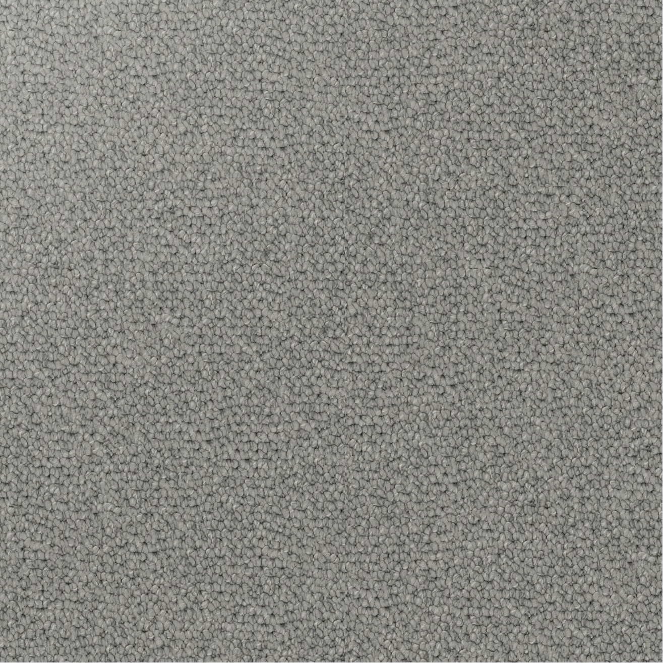 Close-up showing the chunky loop pile texture of solution dyed nylon carpet for family living spaces. Light Grey