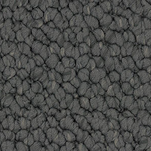 Detailed close-up of solution dyed nylon carpet featuring a chunky loop pile texture, ideal for living rooms and bedrooms. Colour Iron.