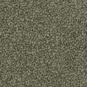 Close-up texture of Soft Sunrise triexta carpet fibres in green