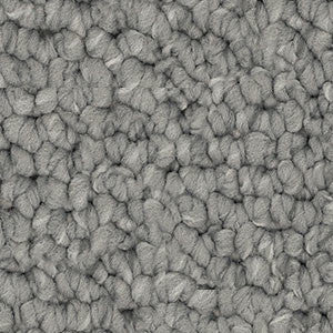 Detailed close-up of solution dyed nylon carpet featuring a chunky loop pile texture, ideal for living rooms and bedrooms. Grey colour.